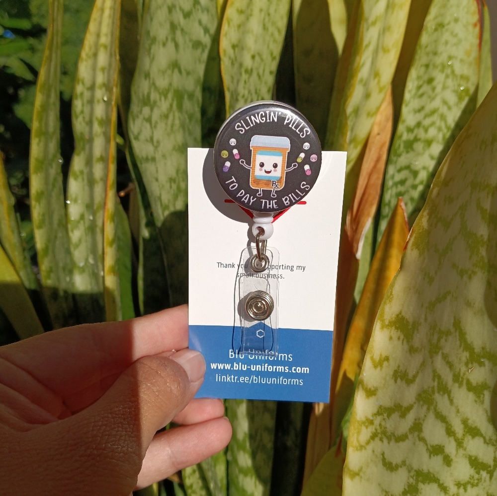 Pharmacist badge reel holder slinging pills